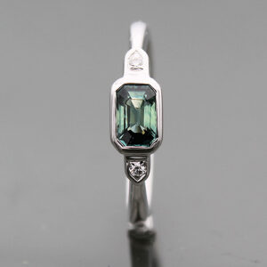 Teal Sapphire and Diamond .62ct Emerald Cut and .02ctw Round 14K WG Ring FIN005